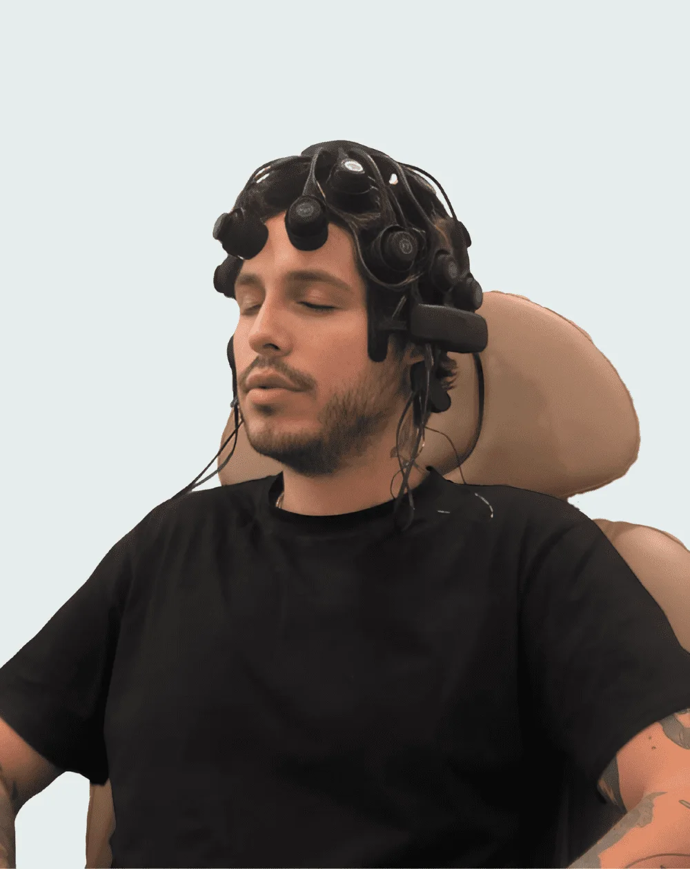Patient wearing the Freedom 20R qEEG brain-mapping headset at Neuron Connect